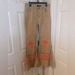 Tan flare jeans with Aztec bottom